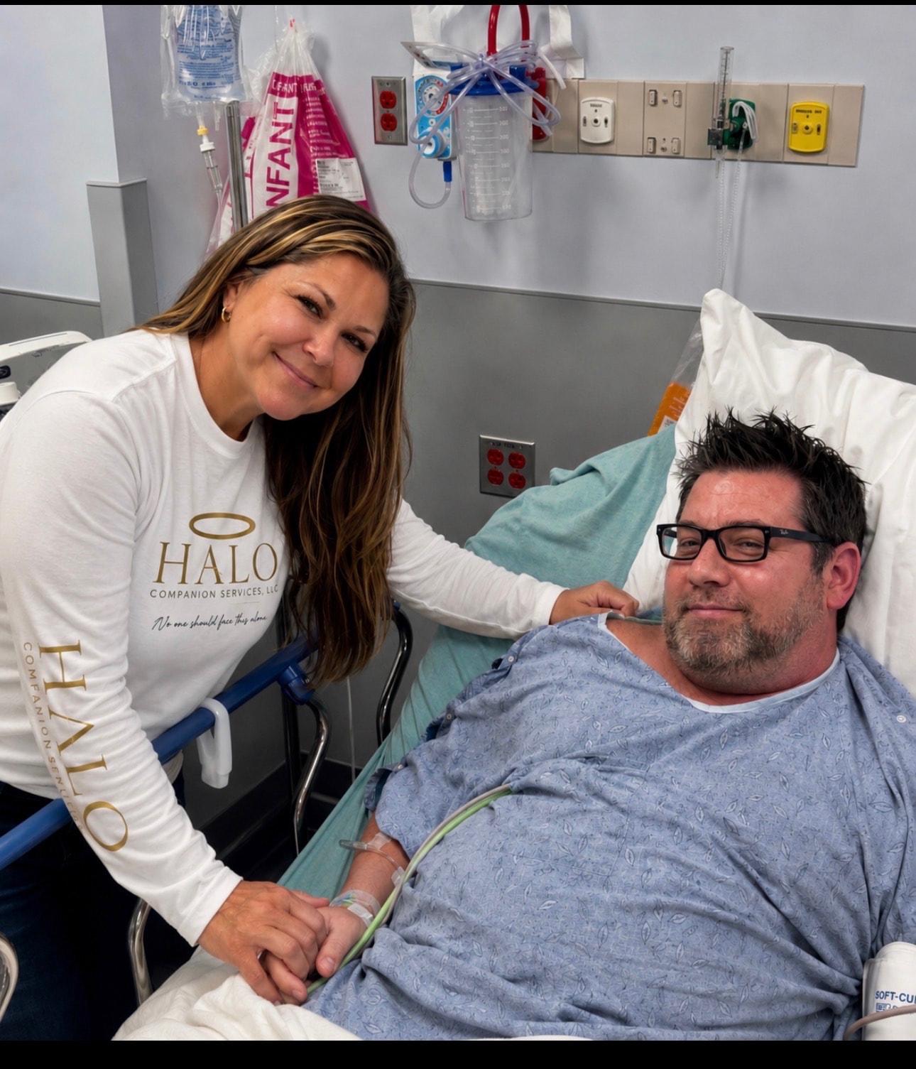 Halo Companion Services team member with a patient in the hospital